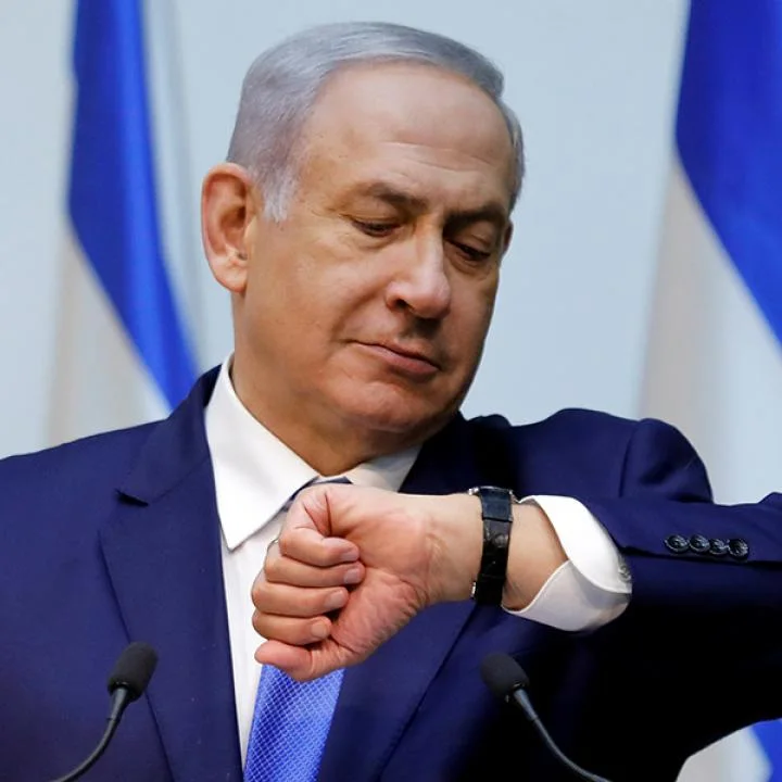 IsraelNetanyahuWatchImpatientRTX6J5WW.jpg